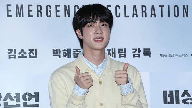 BTS member Jin has started his military service and showcased a new buzzcut he received as he began his boot-camp training on Tuesday morning.