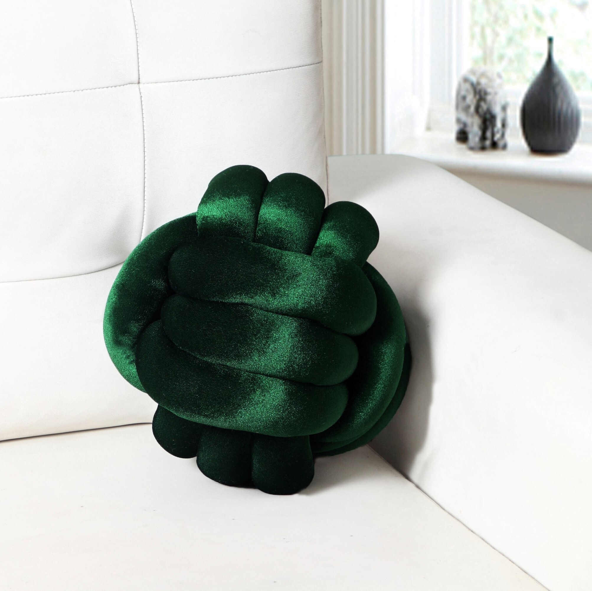 the knotted pillow in emerald