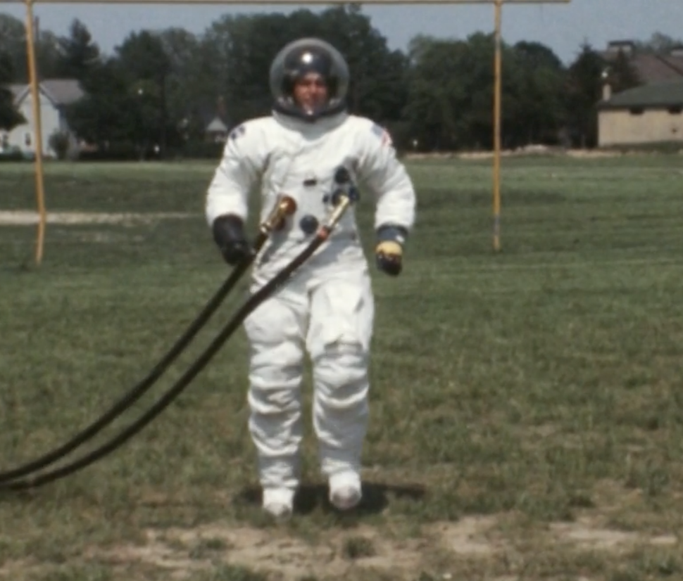 An astronaut in a football field