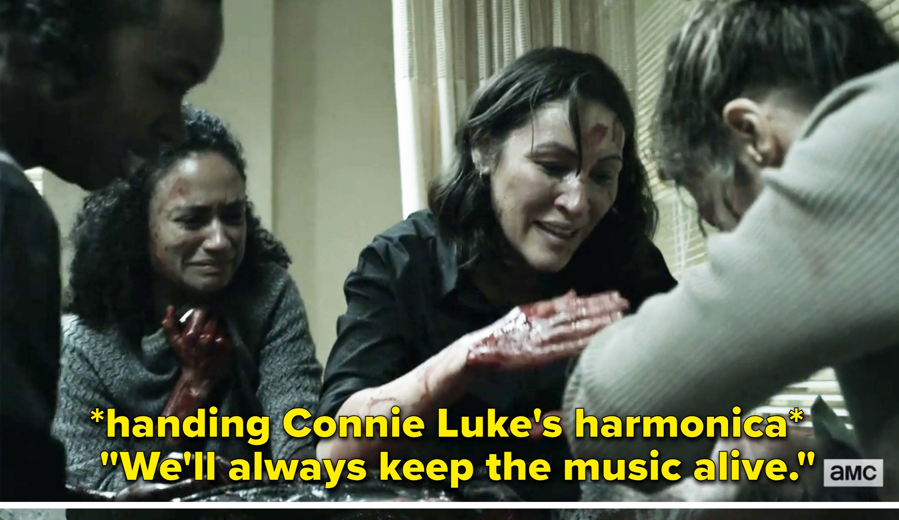 Luke is bleeding out and Yumiko hands Connie Luke&#x27;s harmonica and says &quot;We&#x27;ll always keep the music alive&quot;