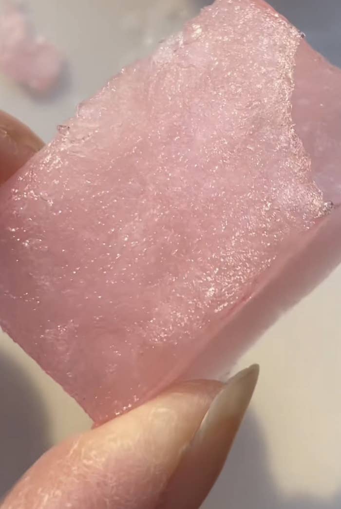 person holding frozen jello up close