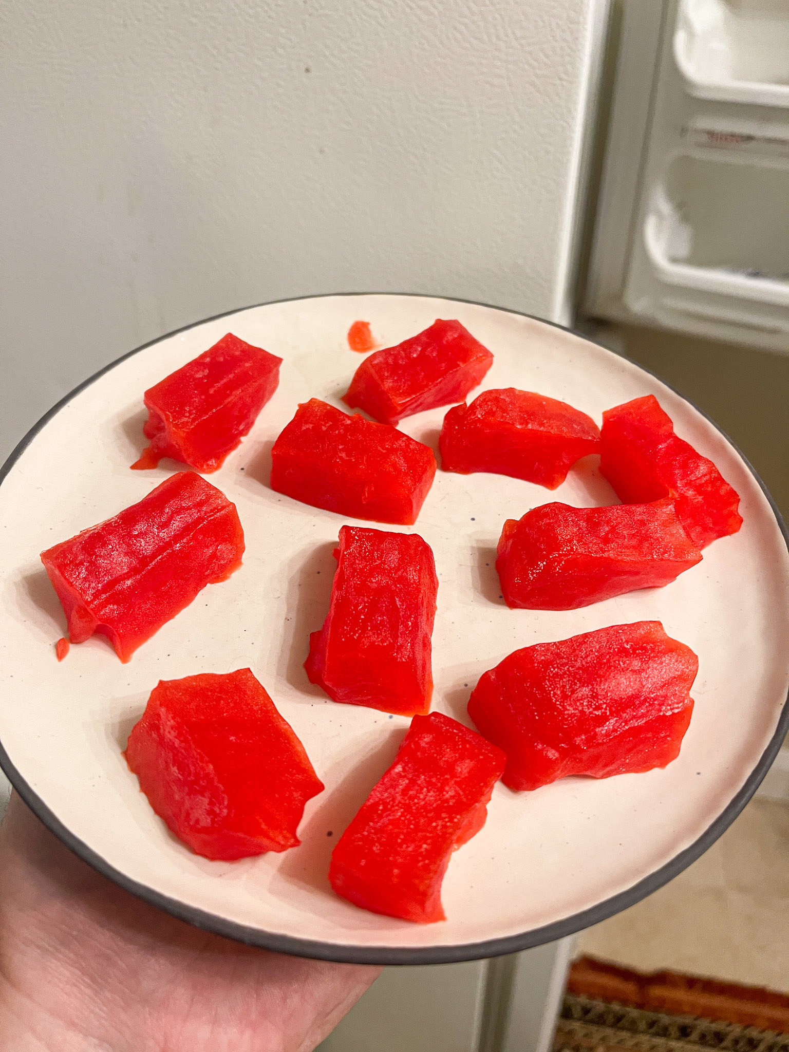 frozen jello on plate that looks kind of like raw tuna