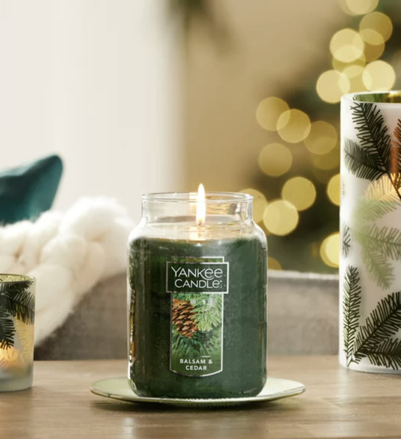 balsam- and cedar-scented Yankee Candle on a living room table
