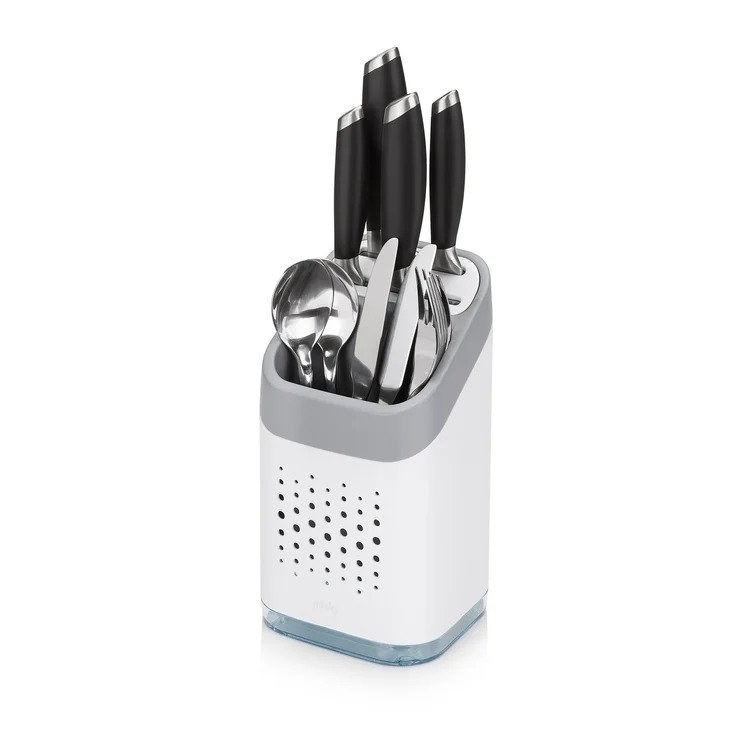 White flatware caddy with spoons, forks, and knives inside
