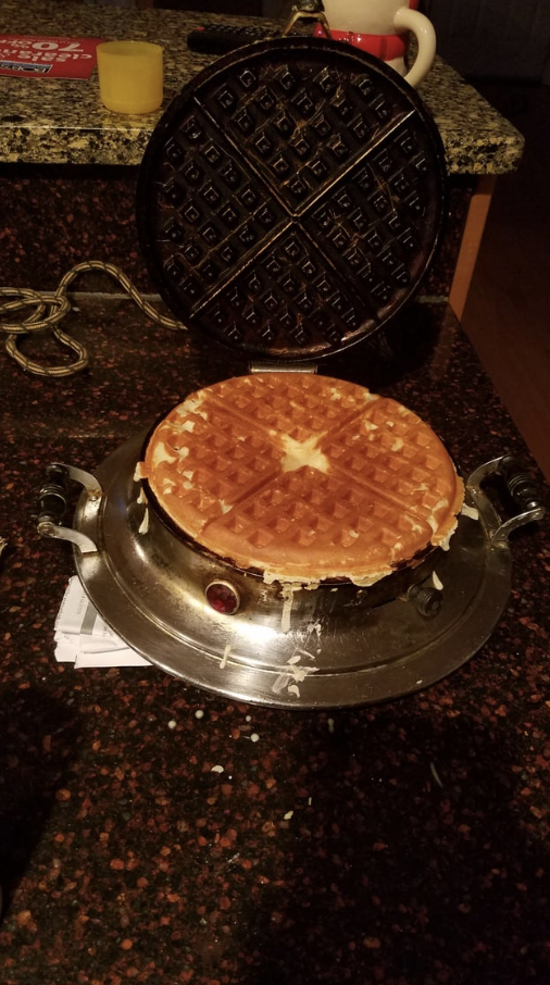 A waffle iron making waffles