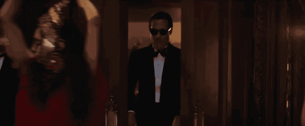 Movie gif: Brad Pitt walking into a party in a tux