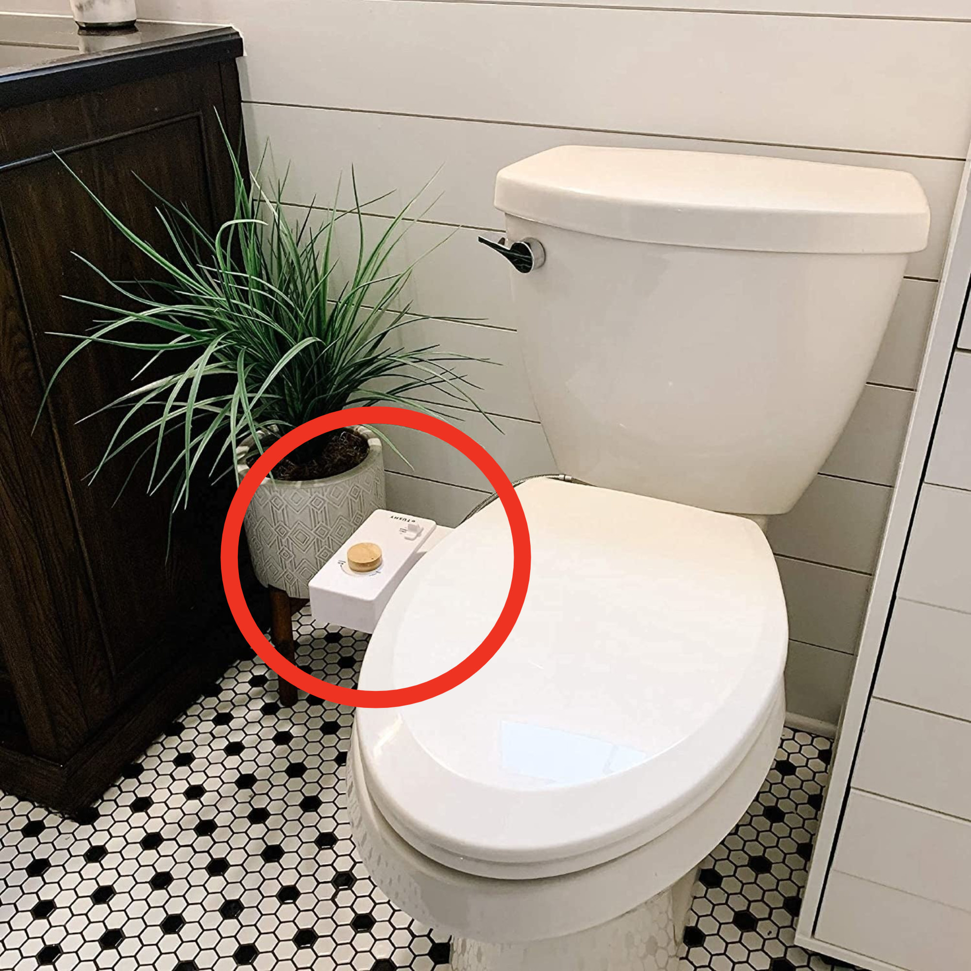 a tushy bidet on a toilet