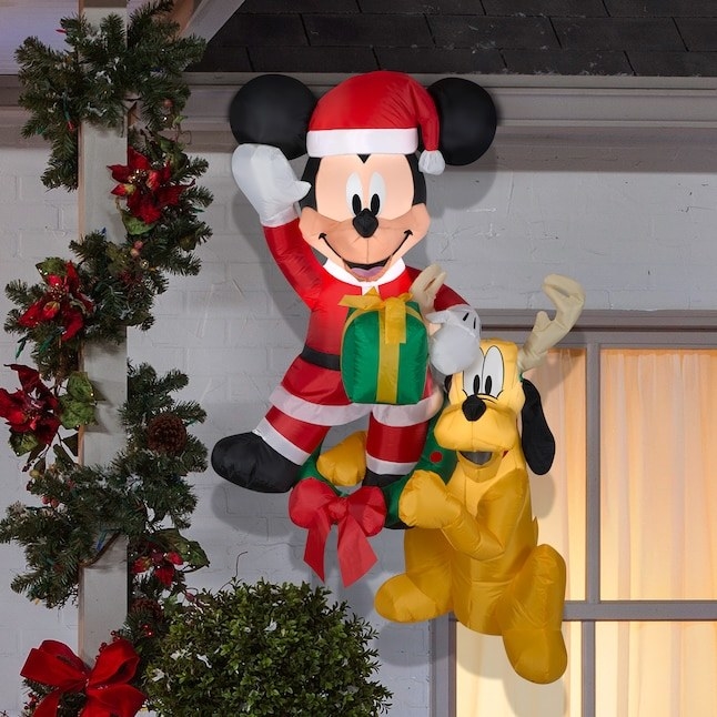 an inflatable decoration of mickey and pluto