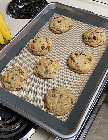 reviewer photo of cookies on a silicone baking bat on a sheet tray