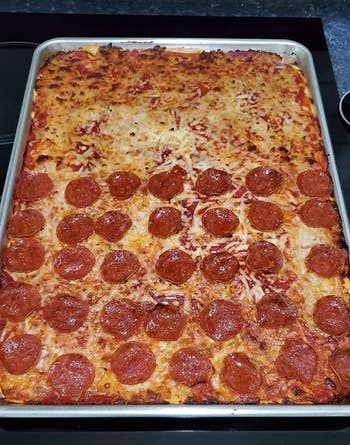 reviewer photo of a pizza baked on the sheet tray