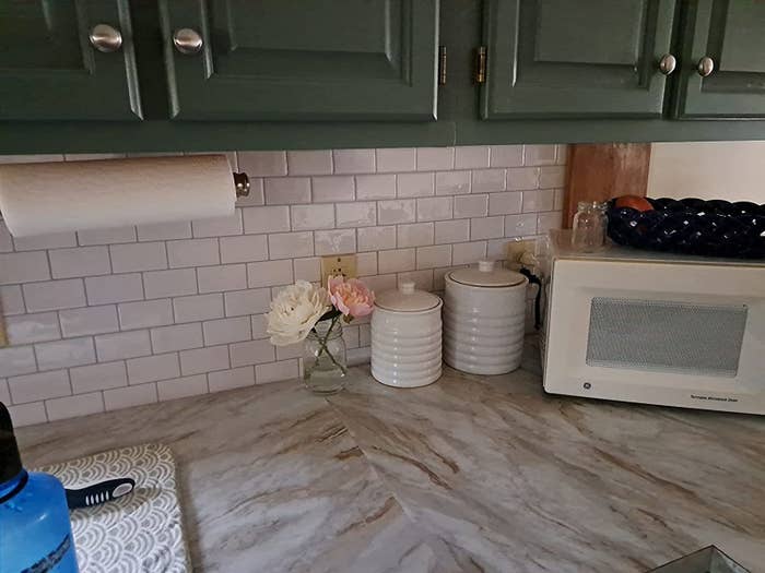 Reviewer image of white subway tile in their kitchen