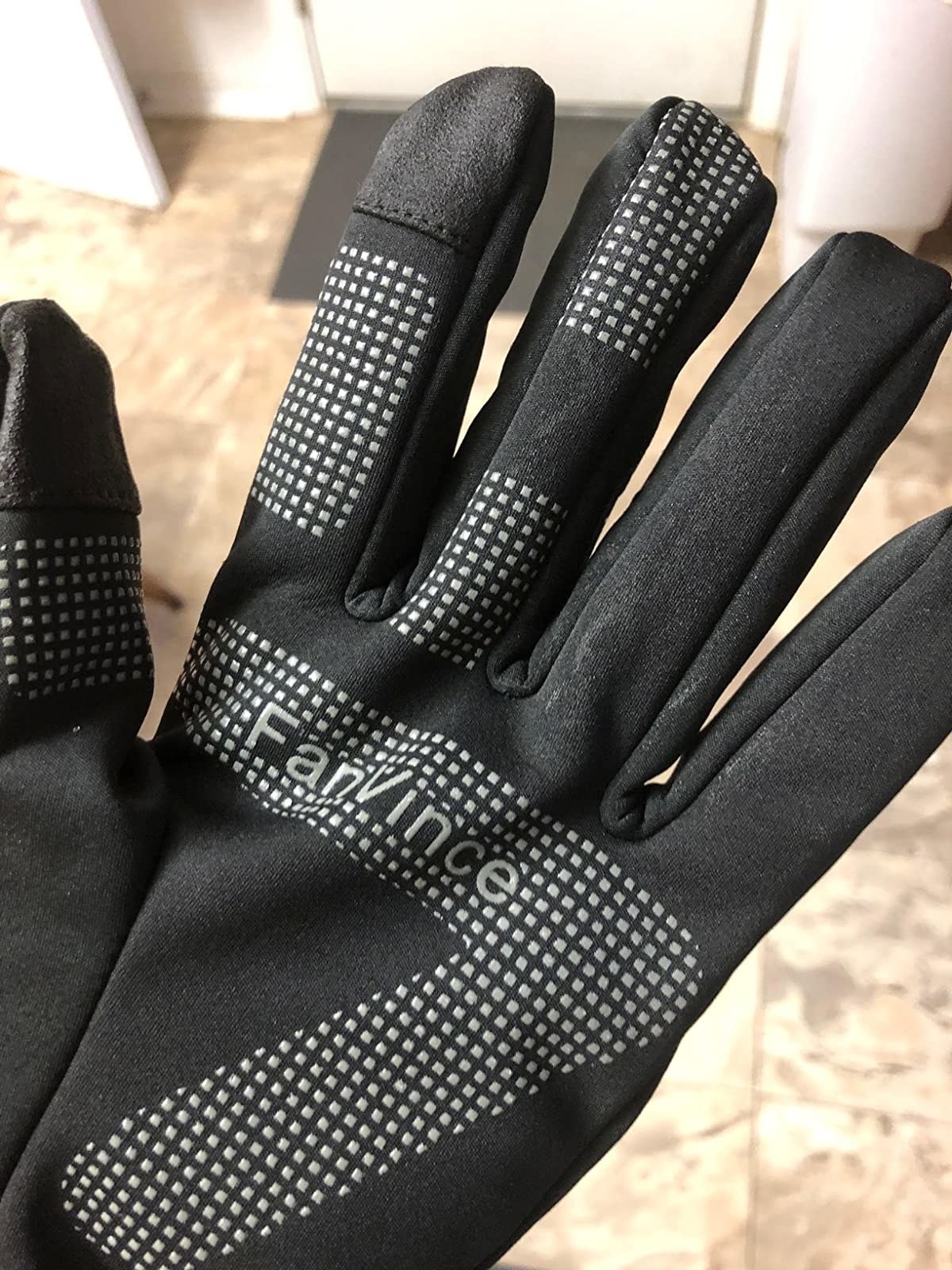 Reviewer wearing black glove