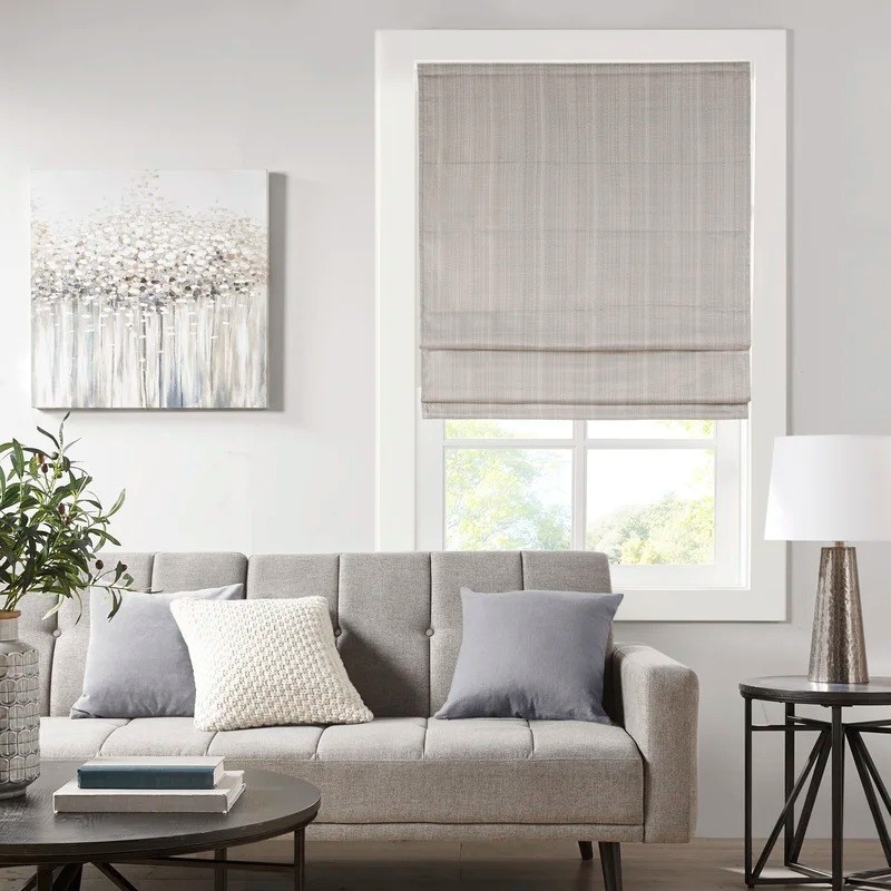 the taupe window shade in a living room