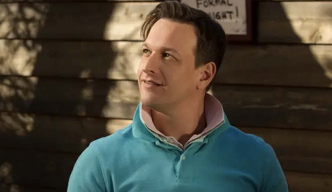 a man wearing two polo shirts with their collars popped