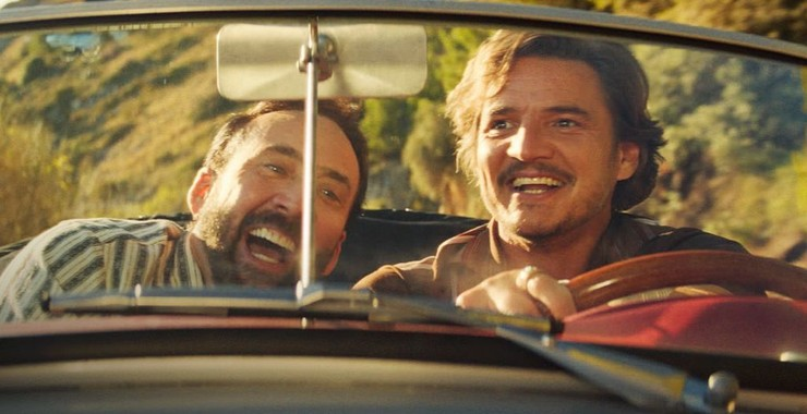 Nicholas Cage as Nicholas Cage and Pedro Pascal as Javi Gutierrez in &quot;The Massive Weight of Unbearable Talent.&quot; Gutierrez drives a car as the two men laugh.