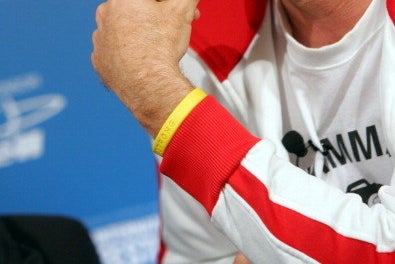 a person wearing a Livestrong bracelet