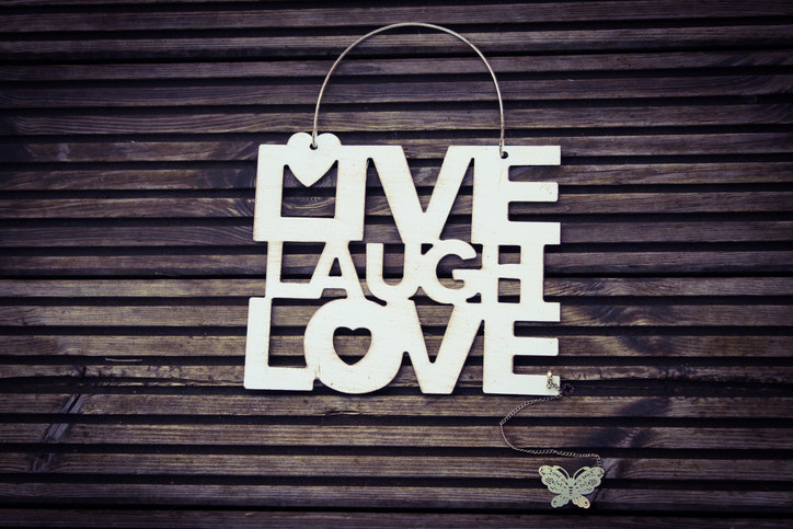 Live laugh love sign on a door