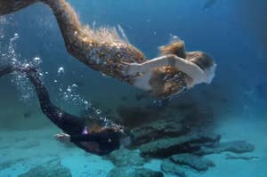 a mermaid and a scuba diver
