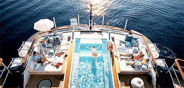 A person floating in a pool on a yacht