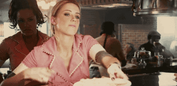 A waitress giving the middle finger