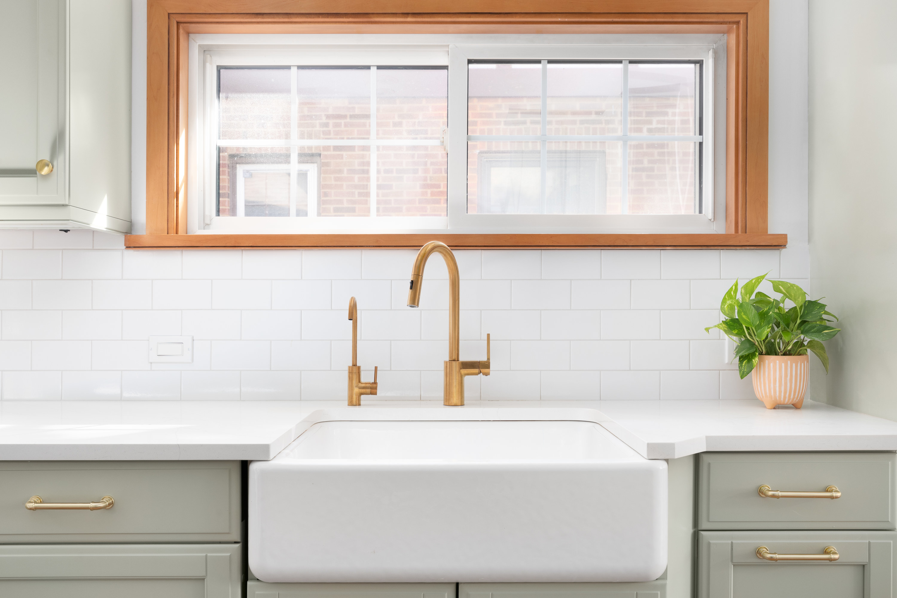Big single-basin kitchen sink with copper fixtures