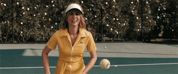 Kristin Wiig getting hit with a tennis ball