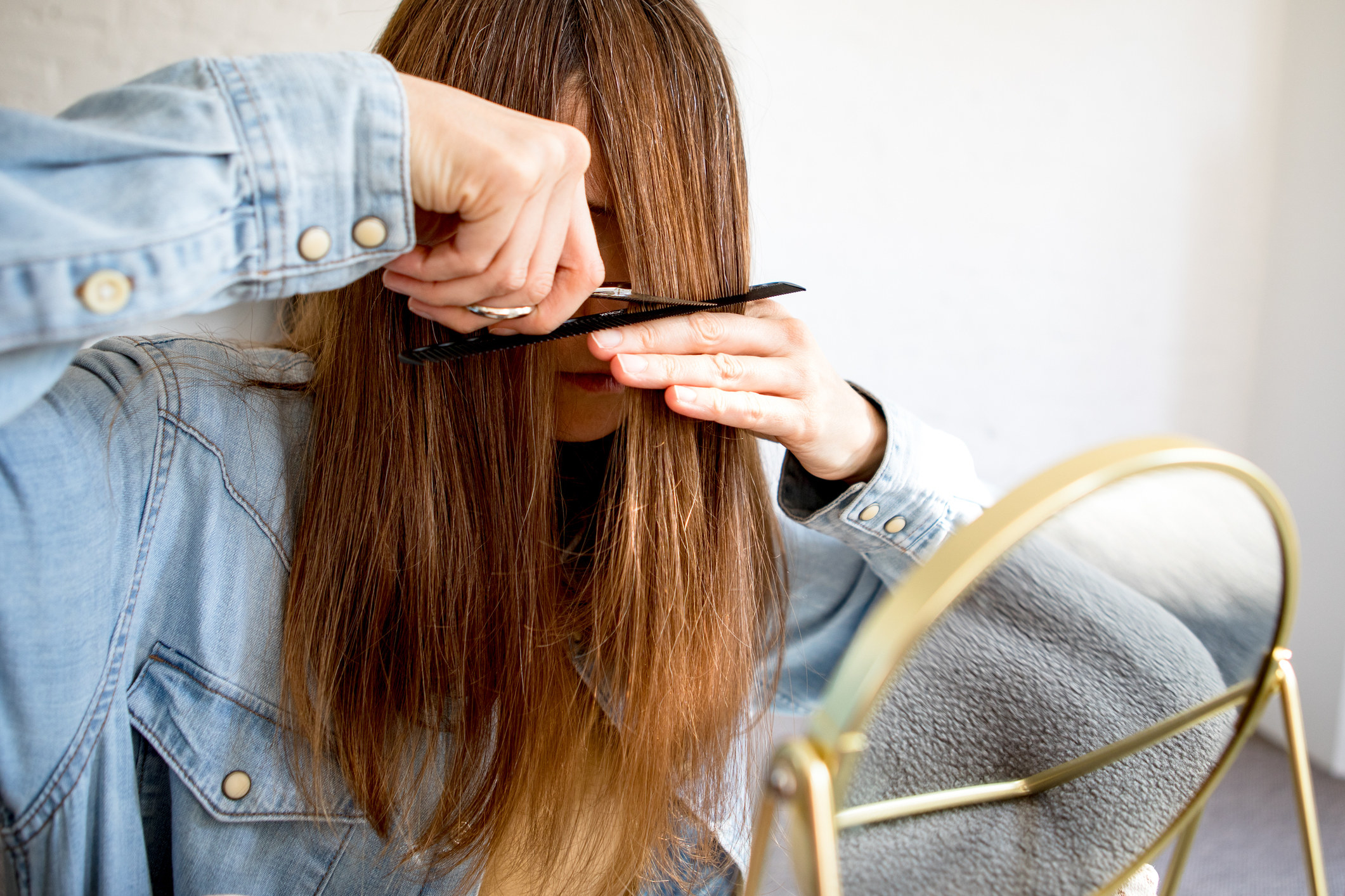 woman cutting her hair