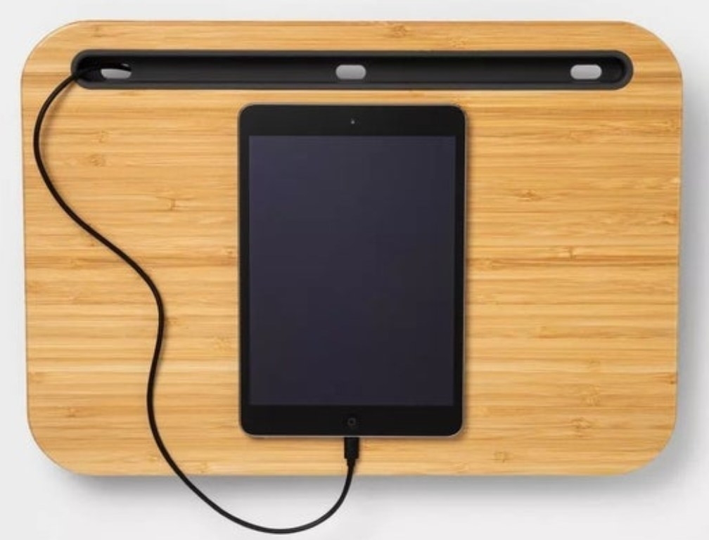 The lap desk with a plugged in ipad