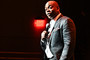 Dave Chappelle is seen holding a microphone