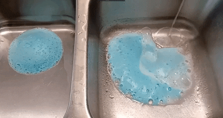 a gif of a sink being cleaned out using the pipe cleaner
