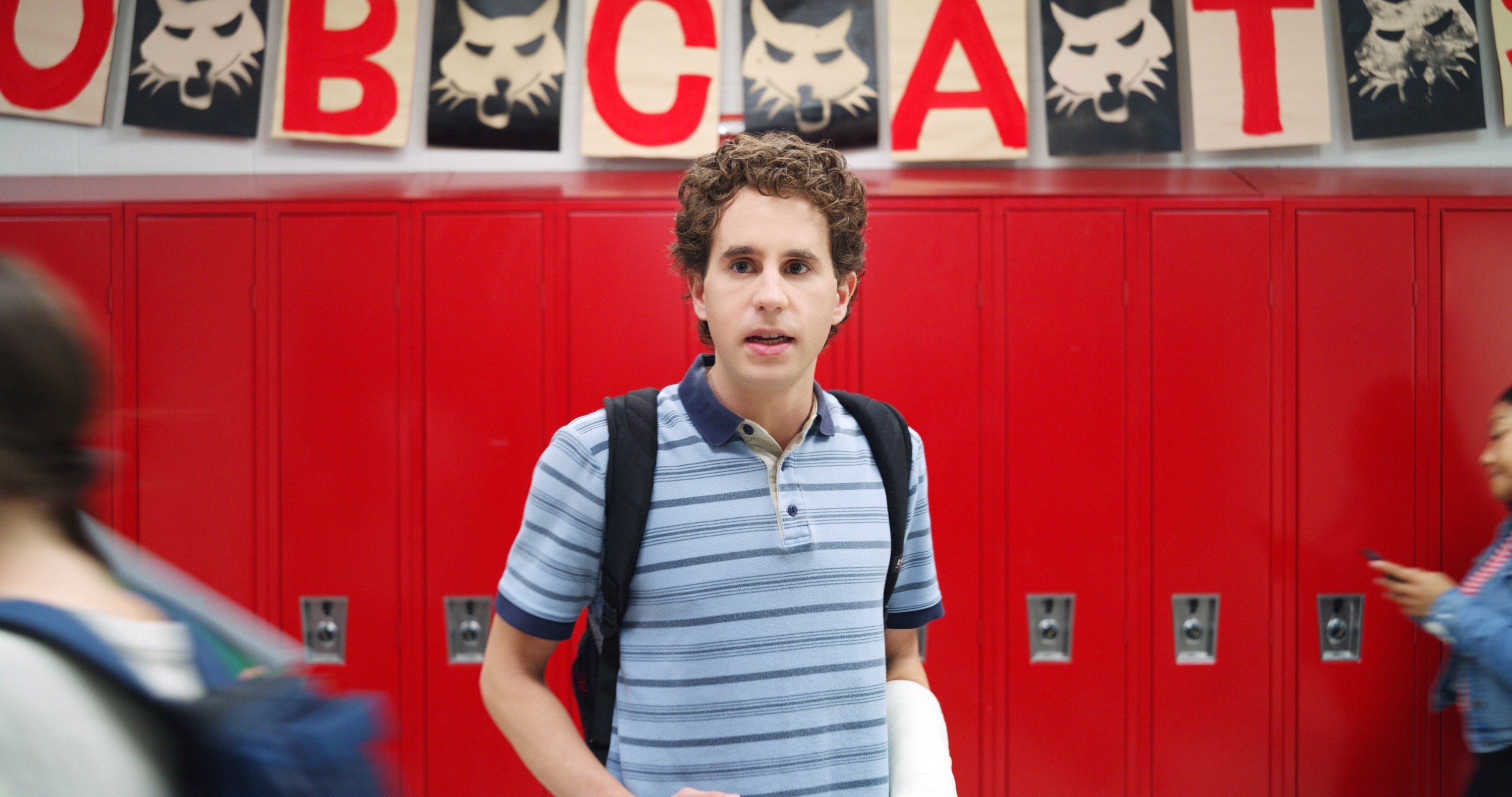 teen standing in front of lockers