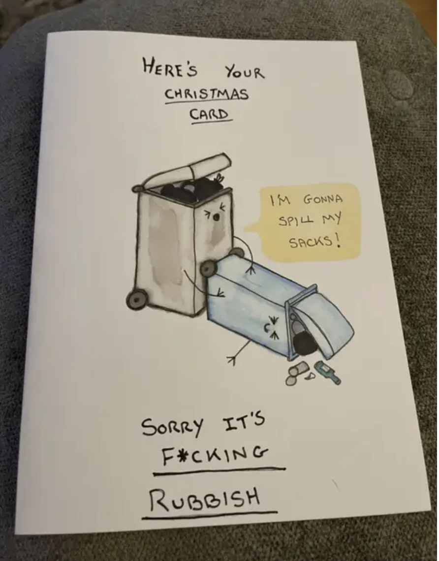 The card features two trash bins having sex, with text that says &quot;Here&#x27;s your Christmas card, sorry it&#x27;s fucking rubbish&quot;