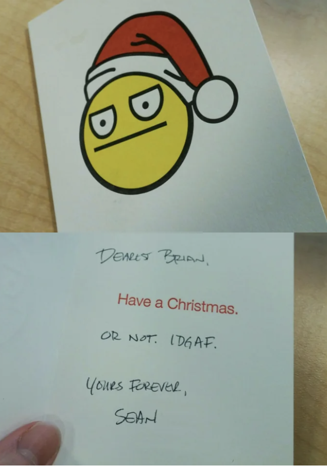 The front of the card has an unenthusiastic emoji wearing a Santa hat, and the inside of the card says &quot;Have a Christmas, or not, I don&#x27;t give a fuck&quot;