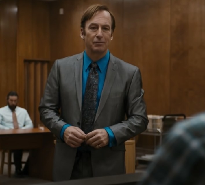 Bob Odenkirk as Saul Goodman walking up to the witness stand as he asks questions