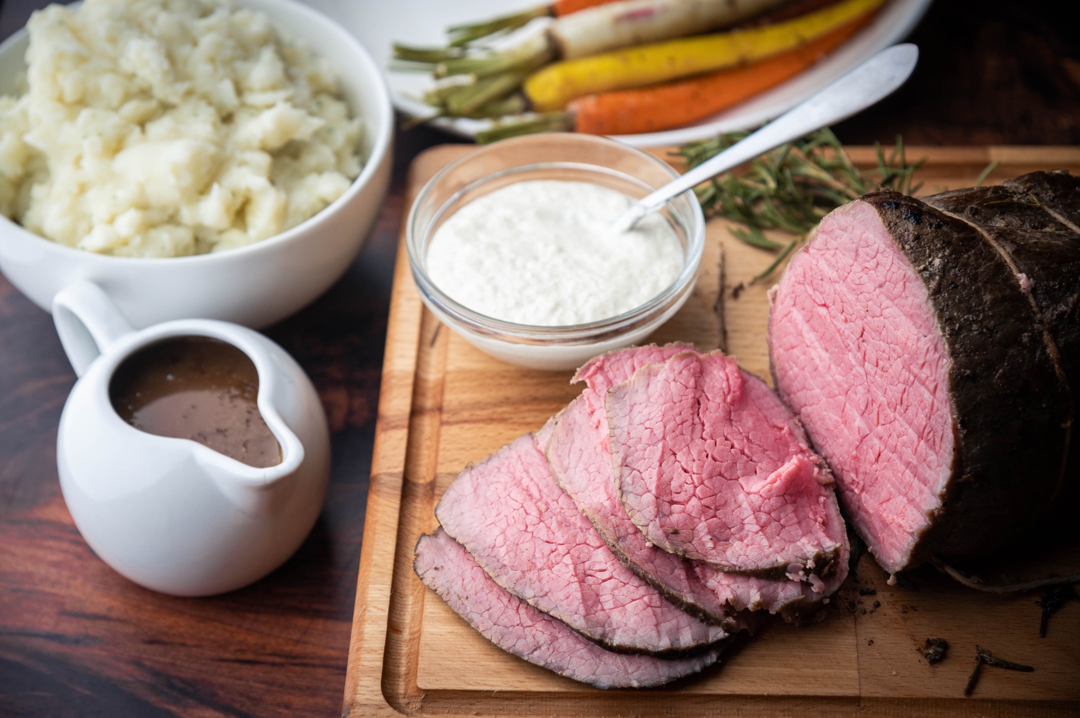 Horseradish and gravy sauce with roast beef slices.