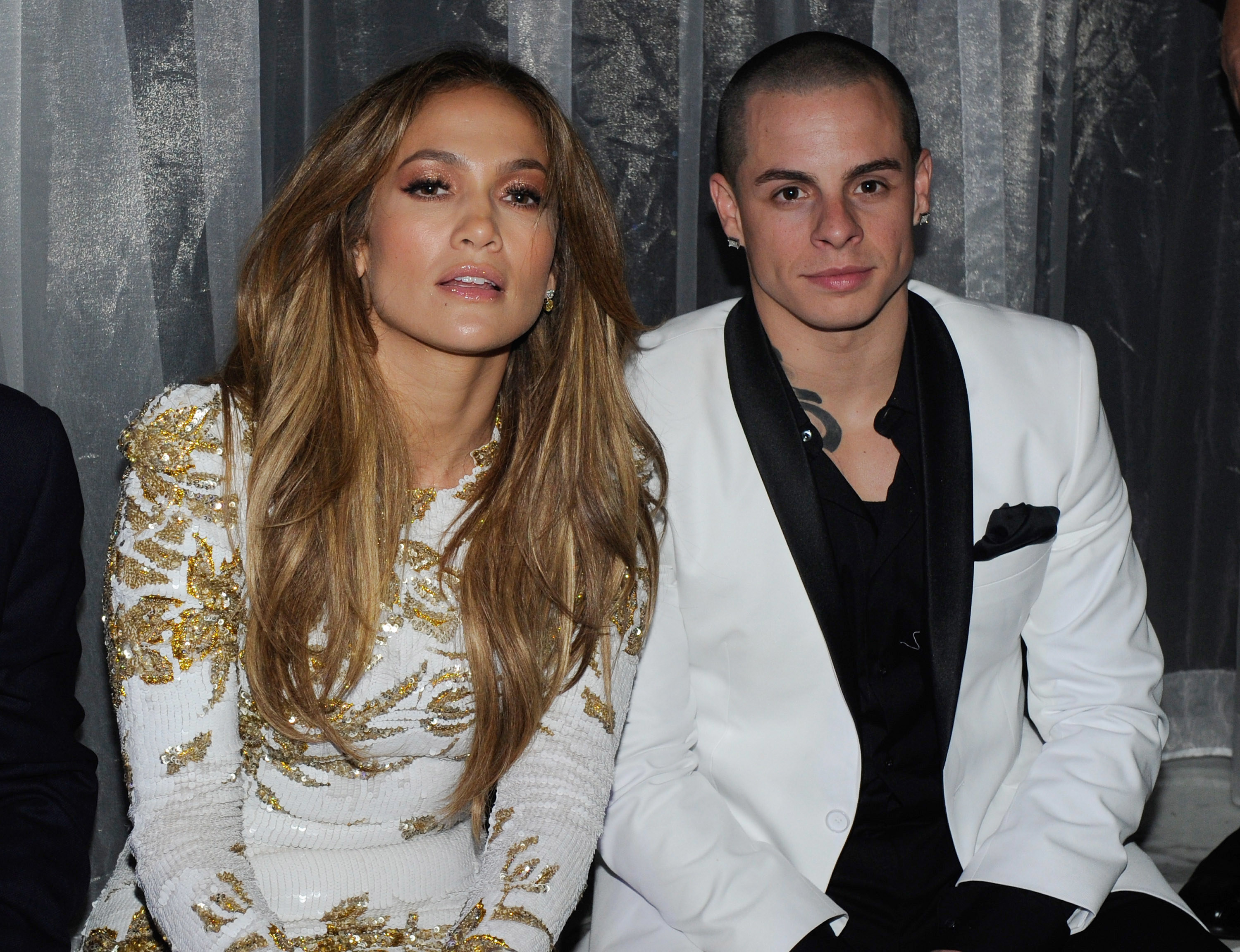 Jennifer Lopez sitting with Casper Smart