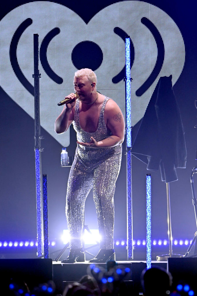 San performing in a sparkly, sleeveless jumpsuit