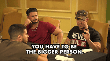 person in a group saying ,you have to be the bigger person