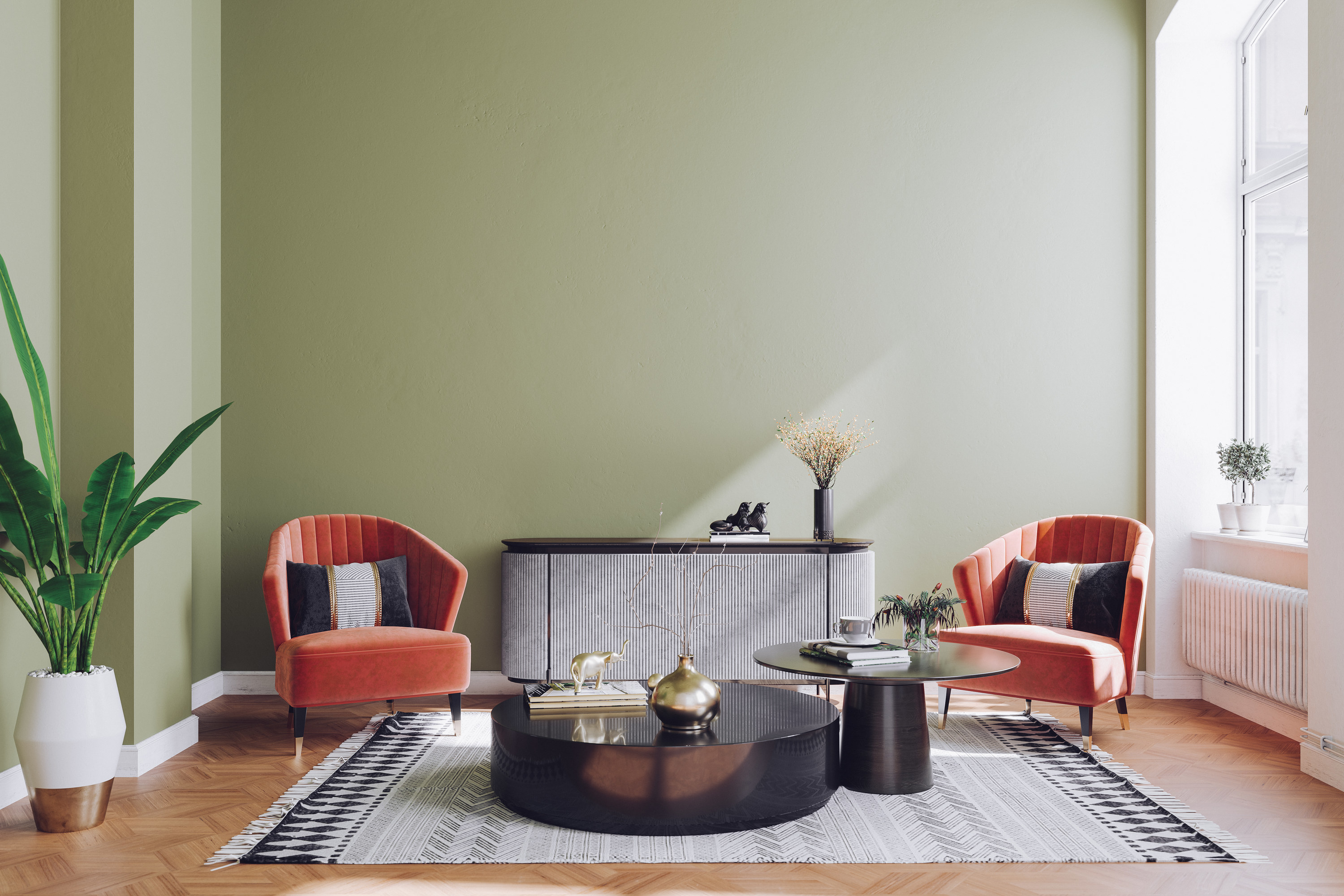 sage green living room with art deco inspired chairs and a console table
