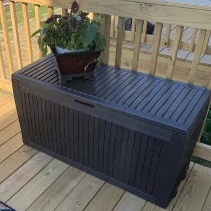 a reviewer photo of the brown deck box