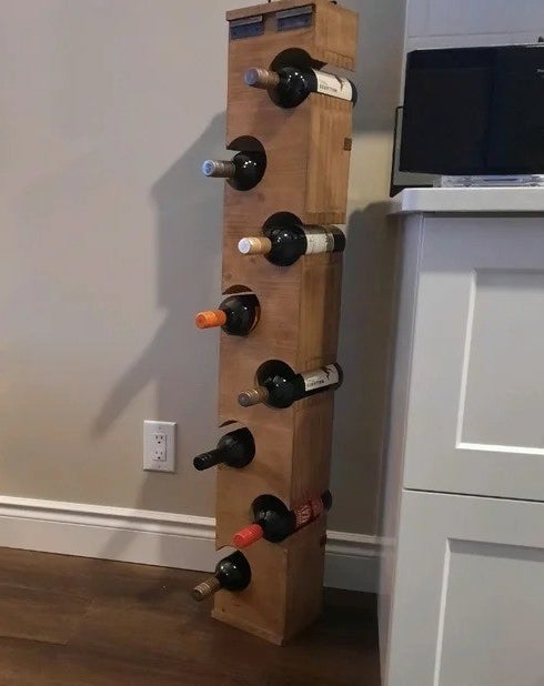 a reviewer photo of the tall wooden wine rack
