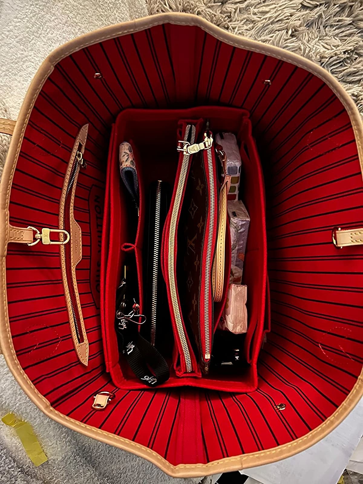 A reviewer&#x27;s tote with the red organizer to match the lining