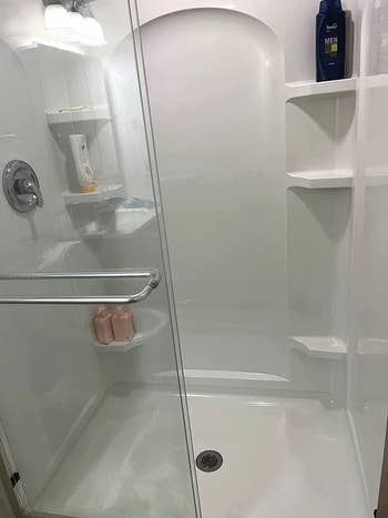 the same shower after, back to being white and shiny, no stains in sight