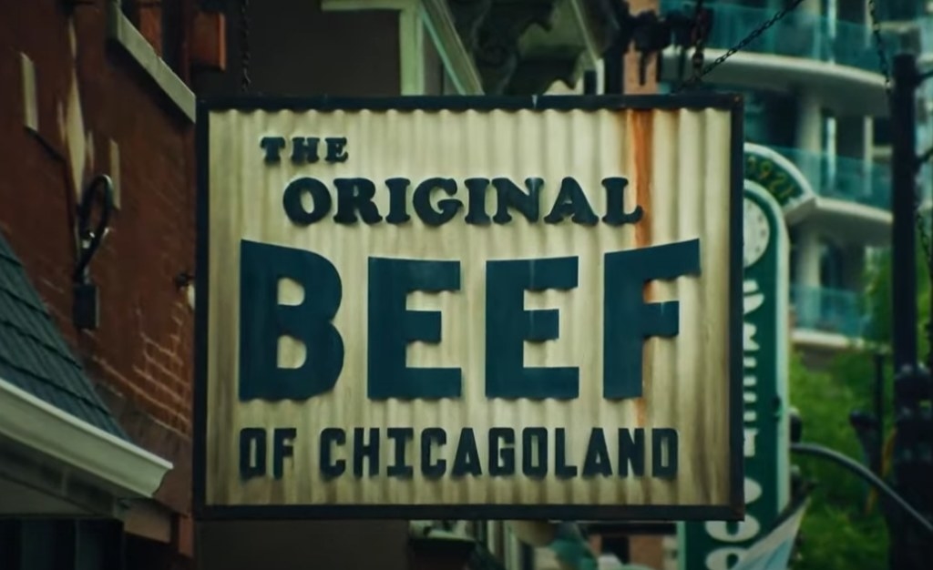 A shot of the restaurant sign for The Beef reading The Original Beef Of Chicagoland