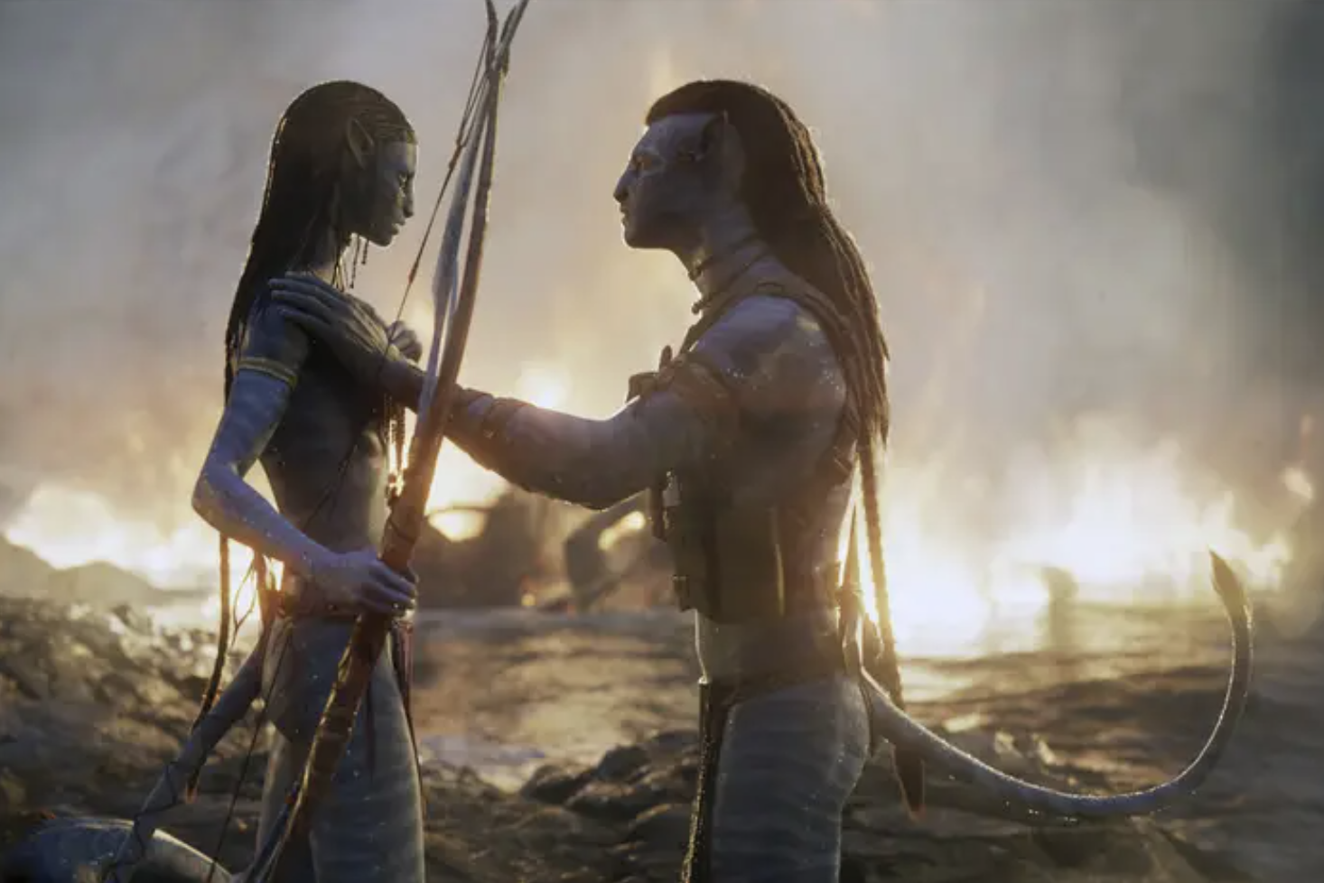 two tall blue na&#x27;vi ppl from avatar face each other at sunrise