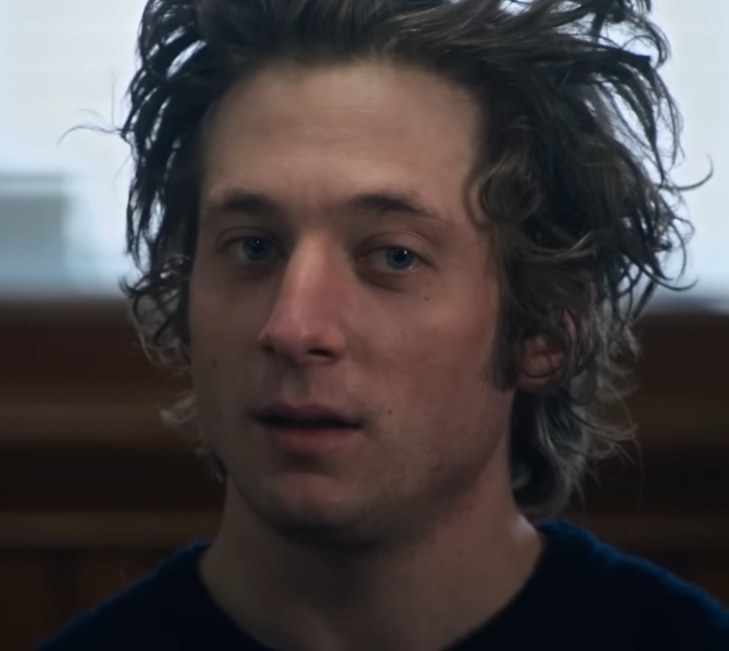 Jeremy Allen White as Carmy talking at a support group about his brother