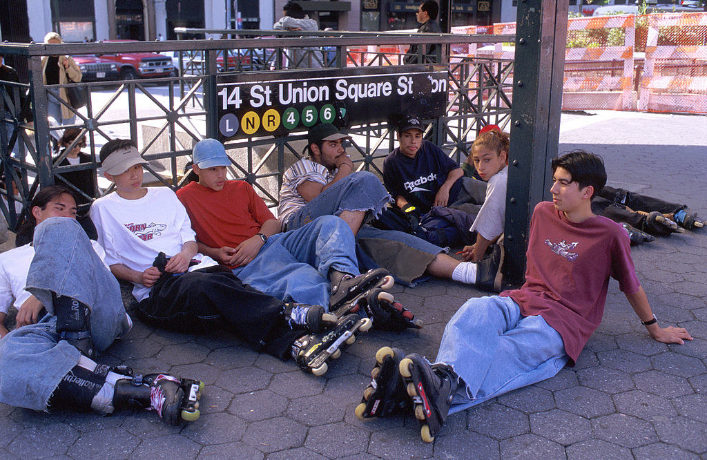 Early &#x27;90s teens in NYC hanging out on the sidewalk wearing Roller Blades