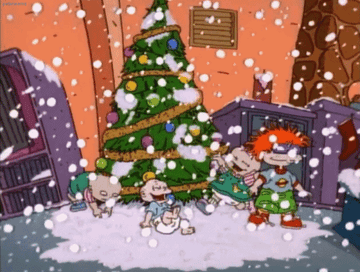 Rugrats playing in snow by a Christmas tree