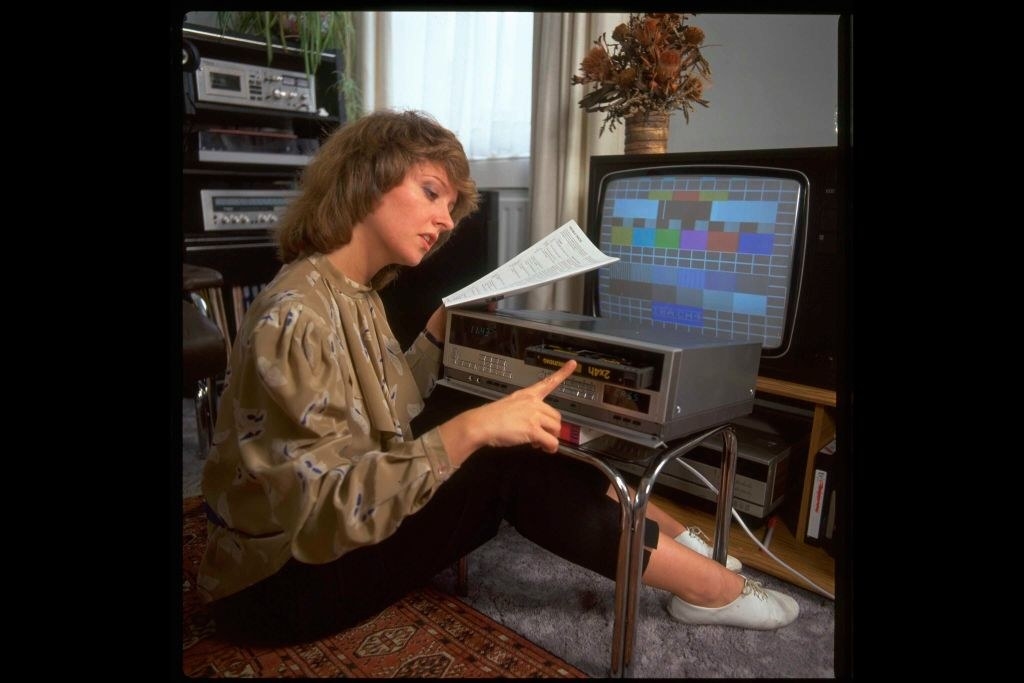 Woman setting up a VCR