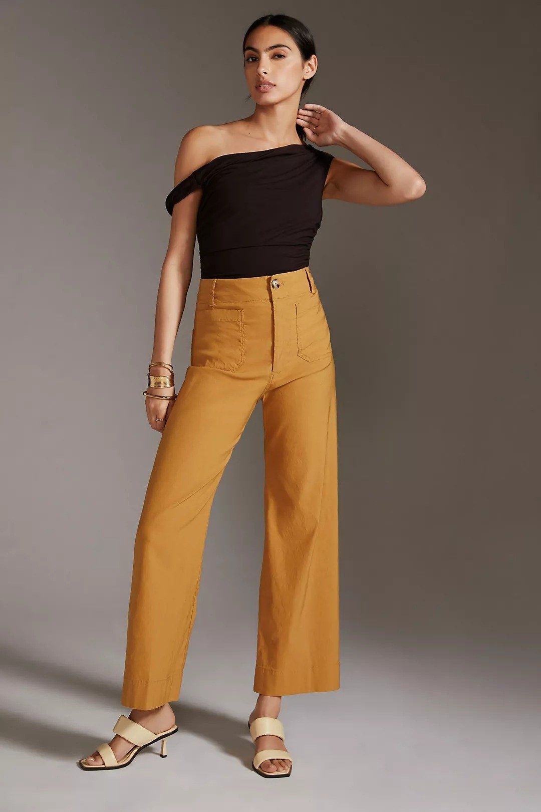 model wearing the trouser pants in mustard yellow